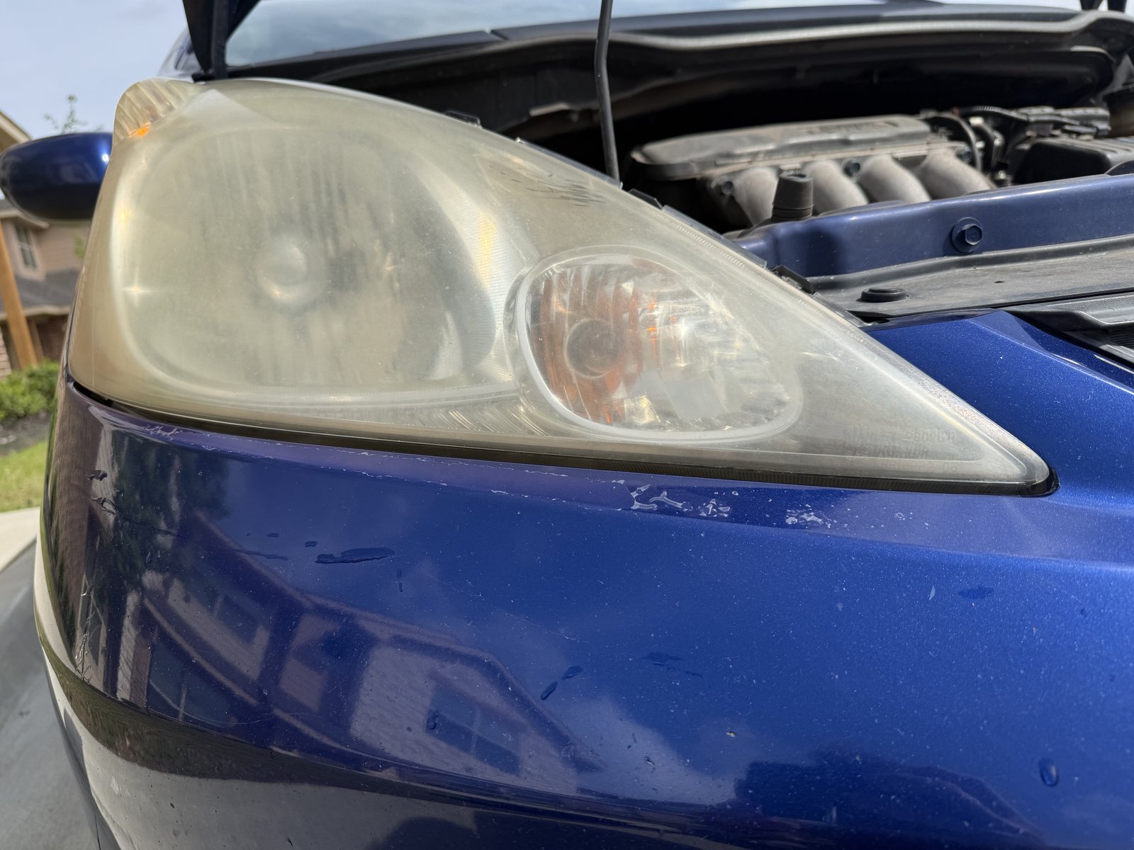 Oxidized cloudy headlight before restoration