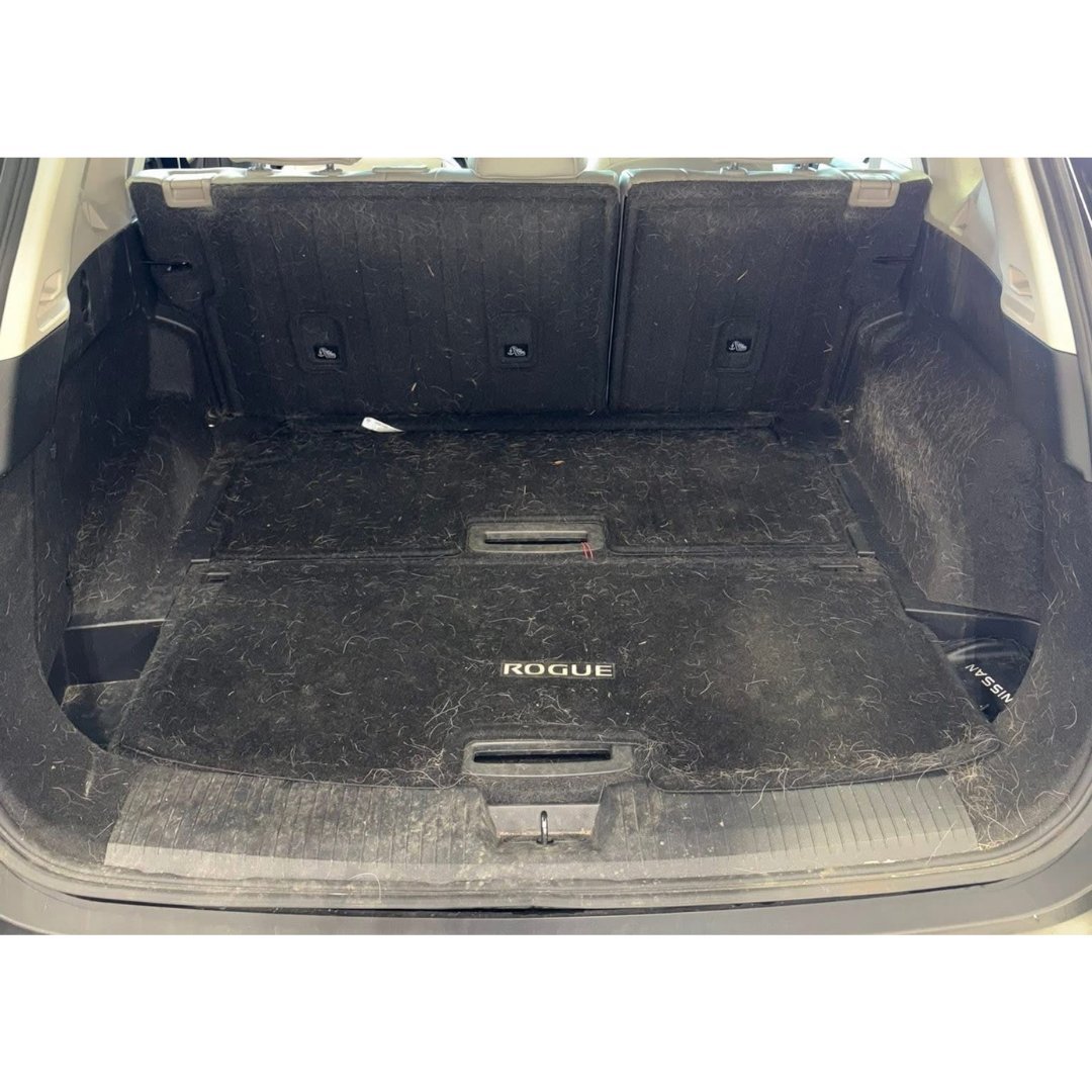 Nissan Rogue trunk before detailing — dirty carpet with pet hair